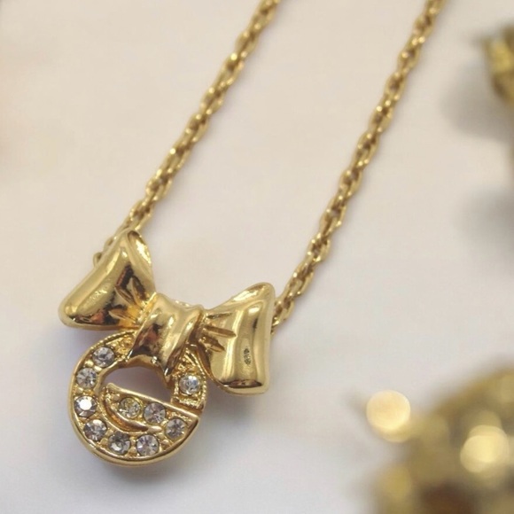 Givenchy Jewelry - GIVENCHY Vintage Signature G with Bow Pendant Necklace ✨🤩